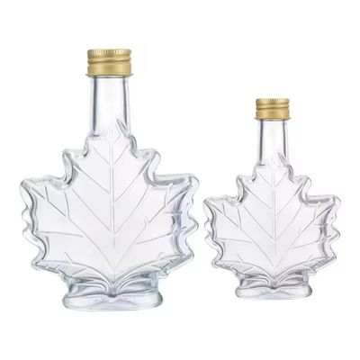 Custom Color Industrial Glass Beverage Bottle with Maple Leaf Shape 50ml 100ml 250ml