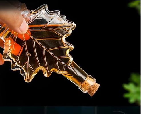 Custom Color Industrial Glass Beverage Bottle with Maple Leaf Shape 50ml 100ml 250ml