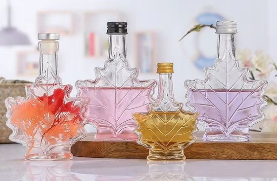 Custom Color Industrial Glass Beverage Bottle with Maple Leaf Shape 50ml 100ml 250ml
